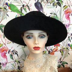 A fabulous vintage 1969 designer hat 'Meteor 15' by artisan hat makers Herbert Johnson of Bond Street London. Made from a black silk plush fabric, it features a wide brim and a high crease. The black band is rib corded and has a flat bow on the left side. The lining is ivory satin and is gathered at the crown. The crown is protected with a clear plastic cover, under which the maker's name is printed in gold and black, and there is also the royal coat of arms, by Appointment to Her Majesty The Qu Bond Street London, Indiana Jones Films, Stylish Womens Hats, Womens Hats, Her Majesty The Queen, Mannequin Heads, Man Hat, Bow Flats, Bond Street