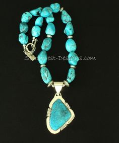 This terrific Necklace showcases a Kingman Turquoise and Sterling Silver Pendant by Nevada Silversmith Jim Daggett. The high-grade Kingman stone is rich blue with gray matrix, and shows slight traces of Pyrite which flash in the light. The Turquoise is wrapped in a handcrafted Bezel which has been cut in a sawtooth pattern along the top edge, and set on Sterling Silver Sheet which has been shaped to match the stone. The Sterling Sheet has been decoratively notched in 3 places, adding style and d Blue Turquoise Necklace With Stones, Unique Blue Turquoise Necklace With Stones, Artisan Blue Turquoise Stones Necklace, Artisan Blue Necklace With Large Stone, Southwestern Blue Chrysocolla Jewelry, Hand-strung Chrysocolla Turquoise Necklace, Hand-strung Blue Turquoise Chrysocolla Necklace, Contemporary Necklace, Pendant Bails