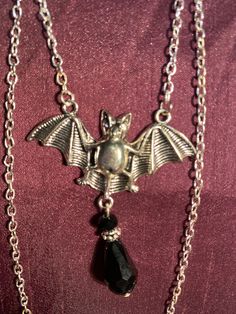 Bat and black gem necklace silver effect Nickel-free Gothic Necklaces For Party, Gothic Dangle Necklaces For Parties, Black Metal Costume Jewelry Necklace, Silver Vampire Style Necklace, Gothic Black Necklace With Silver Chain, Gothic Sterling Silver Necklaces For Parties, Gothic Silver Chain Necklace For Party, Black Halloween Jewelry With Adjustable Chain, Gothic Pendant Necklace With Silver Chain