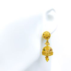 Illuminate your visage with these mesmerizing jhumki earrings, meticulously crafted with a beaded flower motif in gleaming 22k yellow gold. Weighing 15.2 grams, the earrings emanate opulence. The enchanting design cascades down to a length of 1.8 inches, swaying gracefully with every movement. Designed for comfort and ease, they are equipped with a hook back for effortless wear. Product Details Gold Purity(karat): 22k Gold Weight(grams): 15.2 Item Finish: Yellow Gold Earring Style: Hanging/Jhumk 22k Gold Jhumkas For Wedding, Yellow 22k Gold Earrings For Wedding, 22k Gold Chandbali Bridal Earrings For Pierced Ears, Yellow Gold Wedding Jhumkas Drop Earrings, Yellow Gold Chandbali Jhumkas With Meenakari, Yellow Gold Chandbali Jhumkas For Diwali, Diwali Yellow Gold Chandbali Jhumkas, Yellow Gold Plated Meenakari Jhumkas, Yellow Gold Meenakari Jhumkas Gold-plated