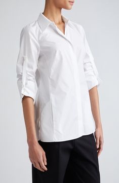 Silk-softened cotton poplin brings elegant ease to this button-up tunic designed with roll-tab cuffs, a point collar and martingale for an array of looks and fits. 28" front length; 29 1/2" back length (size 8) Hidden-button placket Point collar Long sleeves with roll-tab cuffs Martingale 78% cotton, 22% silk Dry clean Imported Designer Clothing Tunic Designs, Silk Button Up, Tunic Shirt, Cotton Silk, Button Placket, Cotton Poplin, Designer Clothing, Top Brands, Button Up