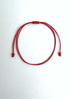 Dark red string ,Red string bracelet, String bracelet, Red string of fate, Minimal bracelet, Lucky bracelet, Good luck bracelet, Simplicity This bracelet is made of two dark red waxed strings and has dark red glass beads at ends. It is adjustable to fit all sizes. *Colours may differ slightly from the original due to the configuration of your computer. *There may be light variations on colour and size. *Items appear larger on your monitor than actual size. Red Adjustable Bracelet Gift, Red Minimalist Jewelry With Adjustable Cord, Minimalist Red Resizable Bracelet, Red String Of Fate Bracelet, Minimalist Adjustable Red Braided Bracelet, Red String Of Fate, Minimal Bracelet, Good Luck Bracelet, Red String Bracelet