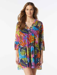 Add feminine charm to your warm-weather style in the Coco Reef Enchant Cover Up Dress. This tiered babydoll dress is made from lightweight fabric that gives you a cool and comfortable overswim option. Featuring a vibrant and colorful jungle inspired print, this swimsuit cover up is as fashionable as it is functional.   Swimsuit Cover Up Dress V-Neckline Bell Sleeves Fabric Content: Signature Mesh - 94% Nylon / 6% Spandex Hand Wash Cold, Line Dry   Model Dimensions Vlada - Height: 5'10", Waist: 2 Casual V-neck Tiered Dress For Beach, Casual V-neck Tiered Dress For Vacation, Green Tiered Ruffle Dress For Beach, Multicolor Tiered Dress For Summer, Multicolor Tiered Summer Dress, Multicolor Ruffled Tiered Dress For Vacation, Multicolor Tiered Dress With Ruffles For Vacation, Flowy V-neck Tiered Dress For Beach, Flowy V-neck Tiered Beach Dress