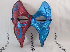 A unique hand-painted & hand-decorated carnival mask. Hand-painted paper base mask by artist Sarah Tomlinson, The Girl with many Secrets. Decorated with jewels, sequins & rhinestones and brushed with a final sparkle layer. Coated twice with a final varnish finish. Backers glued on back of mask, so surface of the mask does not sit directly on face. Elastic used to secure mask on face. Artist signature "The Girl" on back. Please check out Girl with many Secrets Etsy shop for more masks, artwork & Fantasy Masks For Carnival Events, Artistic Masks And Prosthetics For Mardi Gras Carnival, Handmade Halloween Festival Masquerade Mask, Multicolor Masks And Prosthetics For Masquerade And Carnival, Artistic Red Masks For Costume Party, Artistic Red Mask For Costume Party, Multicolor Masks And Prosthetics For Carnival Masquerade, Fantasy Masks For Carnival Themed Events, Themed Masquerade Mask For Carnival Events