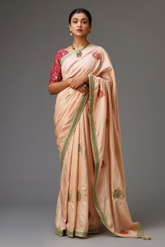 Pink silk saree with round applique embroidered boota all over highlighted with sequins and zari work and tassels on the pallu. Paired with sequin embroidered dark pink V neck blouse and cotton petticoat.
Components: 3
Pattern: Embroidery
Type Of Work: Round applique, sequin, zari
Neckline: V neck
Sleeve Type: Half
Fabric: Saree and Blouse: Silk, Petticoat: Cotton
Color: Pink
Other Details: 
Contrast border
Gota tassel on pallu
Back deep U neck
Occasion: Wedding - Aza Fashions Applique Saree, Saree And Blouse, Blouse Silk, Embroidered Saree, Pink Round, Zari Work, Pattern Embroidery, Silk Embroidery, Pink Saree