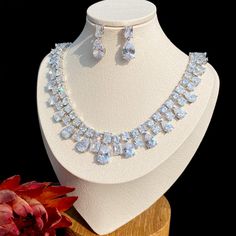 A beautiful piece of remarkable elegance, this exquisite necklace and earrings set will add a touch of sophistication to any wedding gown or formal ensemble. Adorned with high grade cubic zirconia that capture the light from every angle with a perfectly translucent appeal, the pieces are platinum plated for a flawless finish which enhances the intricate detailing and conveys a modern take on old elegance. Necklace: 17" (approx. 43cm) long and closes with a secure fold-over clasp. If longer is ne Elegant Cubic Zirconia Bridal Sets, Formal Sparkling Cubic Zirconia Bridal Necklace, Elegant Rhinestone Bridal Sets For Formal Occasions, Elegant Bridal Sets With Rhinestones For Formal Occasions, Glamorous Cubic Zirconia Bridal Necklace For Formal Occasions, Elegant Cubic Zirconia Bridal Necklace, Elegant Formal Rhinestone Necklace With Cubic Zirconia, Formal Bridal Necklace With Rhinestones And Cubic Zirconia, White Cubic Zirconia Bridal Necklace For Formal Occasions