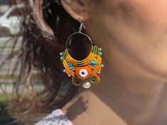 *length 8cm (3,1'') *width 5 cm (1,9'') *Evil Eye Bead Earrings *It has real pearl on the tip *Color; yellow, orange, green eye bead, pearl macrame earrings *The evil eye bead will protect you and the pearl will give you strength to balance positive energy. *on order; brown-cream-tan, blue-red-purple, black-white, turquoise-orange-yellow combinations are made *I accept returns * Does not cause allergies, comfortable *made with macrame technique, no glue *eco-friendly, recyclable *Packing will be Festival Macrame Dangle Jewelry, Bohemian Macrame Beaded Earrings For Festivals, Festival Adjustable Macrame Beaded Earrings, Adjustable Macrame Beaded Earrings For Festival, Handmade Bohemian Beaded Earrings, Bohemian Evil Eye Earrings As Gift, Handmade Hippie Earrings For Beach, Handmade Bohemian Earrings For Summer, Handmade Hippie Style Earrings For Festivals