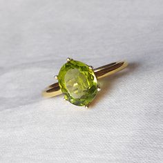 The Buyer Must Be Reads All Details About The Product . Material  14k Yellow Gold  . Gemstone  Natural Peridot  . Gemstone Colour .... Green . Gemstone Size  6x8 mm . Gemstone Shape  Oval . Birthstone  August Birthstone Peridot Band Ring, Classic Wedding Diamond Ring With Peridot, Elegant Green Oval Topaz Ring, Classic Oval Gemstones For Wedding, Green Oval Sapphire Ring With Center Stone, Classic Peridot Gemstone Diamond Ring, Oval Peridot Diamond Ring For Formal Occasions, Oval May Birthstone Gemstone With Center Stone, Classic Peridot Diamond Ring