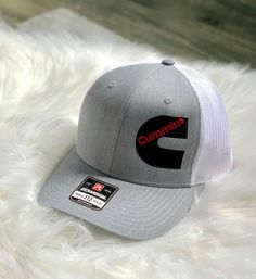 Listing is for a customizable trucker hat. There is a discount if you are purchasing 12 or more hats. If you need quantities over 100 message me for a price quote. Pricing includes digitizing your logo, and the embroidery on the hat. Turn around time can vary depending on current work load but will be between 1-3 weeks. Hat colors are listed, leave your hat color choices in the notes at check out. I will need a high resolution image sent after purchasing the hat. Once it has digitized I will sen Gray Trucker Hat With Embroidered Logo, Gray Hat With Embroidered Logo And Curved Bill, Gray Trucker Cap, Gray Curved Bill Hat With Embroidered Logo, Gray Trucker Hat With Embroidered Logo And Flat Bill, Gray Trucker Baseball Cap With Flat Bill, Gray Trucker Hat One Size, Gray Cap With Embroidered Logo, Trucker Snapback Hat With Embroidered Logo And Curved Brim