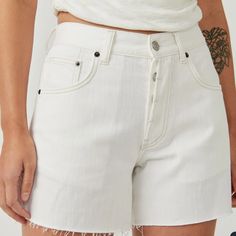 The Perfect Wear-Everywhere Pair From The We The Free Collection, These Shorts Are A True Essential In Any Denim Drawer. Featuring A Mid-Rise Fit, Relaxed Silhouette, Button-Fly Closure, And A Frayed Hem Detailing. 100% Cotton High Rise Cotton Shorts For Everyday, Casual White Jean Shorts, Cotton Bottoms With Button Closure And Short Length, Casual White Jean Shorts For Everyday, Everyday White Shorts, White High Rise Bottoms For Everyday, White High-rise Bottoms For Everyday, White Straight Leg Jean Shorts For Spring, White Everyday Short Bottoms