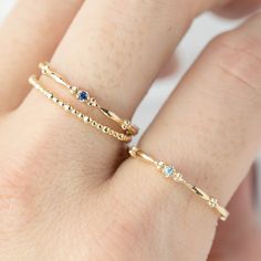 This dainty birthstone stackable ring is unlike any other, the band has a unique design all around which gives a bit of antique feel. Perfect gift for July birthdays! * Stock size: US 7 * Genuine 1.5mm blue sapphire * Band width: ≈1.75mm * Setting size: ≈2mm * Material: 14k solid yellow gold (rose gold or white gold option available) * Made of 100% recycled precious metal and ethically sourced gemstone * Comes in a gift box with a bow ready for gifting * Handmade with love and great care in New Fine Jewelry Sapphire Stackable Rings With Bezel Setting, Fine Sapphire Stackable Rings With Bezel Setting, Yellow Gold Stackable Sapphire Ring, Fine Jewelry 14k Gold Filled Stackable Promise Rings, Everyday Stackable Sapphire Ring Fine Jewelry, Everyday Stackable Sapphire Ring In Fine Jewelry Style, 14k Gold Filled Stackable Rings For Promise, 14k Gold Filled Stackable Rings As Promise Ring, Blue Sapphire Stackable Birthstone Ring