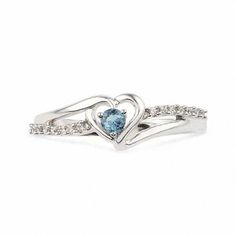 Sweet and so romantic, this birthstone ring is certain to win her heart. Beautifully crafted in sleek sterling silver, this ring features a heart-shaped frame centered with a glistening icy-blue aquamarine, the traditional gemstone for those born in March. A ribbon of shimmering diamond accents sweeps across the style, adding brilliant sparkle. Buffed to a polished luster, this ring is certain to become a treasured favorite. Custom made to fit her ring size. Sterling silver rings cannot be resized after purchase. White Gold Aquamarine Birthstone Ring For Anniversary, Birthstone Open Heart Promise Ring, Open Heart Birthstone Promise Ring, Heart Cut Topaz Birthstone Ring For Anniversary, Silver Heart Ring With Birthstone For Proposal, Light Blue Birthstone Ring For Promise, White Gold Heart Cut Birthstone Ring, Light Blue Promise Ring With Birthstone, White Gold Aquamarine Birthstone Ring For Promise