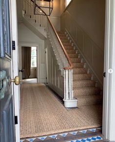 an entryway with stairs leading to the second floor