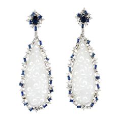 These stunning hand carved Jade earrings are thoughtfully and meticulously crafted in 18-karat gold. It is set in 22.37 carats Jade, 2.75 carats blue sapphire and 2.2 carats of baguette diamonds. FOLLOW MEGHNA JEWELS storefront to view the latest collection & exclusive pieces. Meghna Jewels is proudly rated as a Top Seller on 1stDibs with 5 star customer reviews. All items manufactured by us are handmade and can be customized or redesigned. Composition Size-72 X 24 MM Total Weight-19.827 Gold We Baguette Diamond Earrings, Carved Jade, Diamond Dangle Earrings, Diamond Jewelry Designs, Jade Earrings, Gold Diamond Earrings, White Jade, Jade Carving, Jade Jewelry