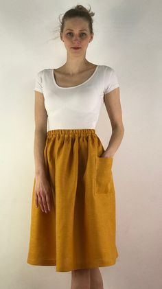 "Write the selected color in the message Handmade mustard linen midi skirt with зatch pockets on the sides, elastic waistband, perfect for casual wear and suitable for any occasion in any season Details: - 100% natural linen produced in Europe ; - medium weight (180 gram per square meter); - color: mustard, could be any from our colors catalog (color samples at the photo); Made to order, approximately a few days, If you have any questions please message me and I will be glad to answer. Size guid Linen Skirt With Elastic Waistband For Day Out, Summer Skirt With Pockets For Day Out, Everyday Summer Skirt With Elastic Waistband, Cotton Orange Skirt For Day Out, Orange Cotton Skirt For Day Out, Everyday Summer Skirt With Pockets, Summer Cotton Skirt With Pockets, Solid Color Summer Skirt With Side Pockets, Summer Solid Skirt With Side Pockets