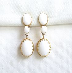 Schreiner NY Vintage Dangling Clip Back Vintage Earrings - White Glass Cabochons - Designer Signed - NY Estate Jewelry Formal White Clip-on Earrings, Classic White Drop Clip-on Earrings, White Classic Drop Clip-on Earrings, White Victorian Dangle Jewelry, White Matching Clip-on Earrings For Formal Occasions, Antique White Drop Earrings, White Victorian Earrings For Formal Occasions, Victorian Style White Earrings For Formal Occasions, Vintage White Dangle Jewelry