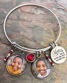 "Mom bracelets feature your favorite photo, Mom saying engraved in stainless steel, matching beads, and your choice of rhinestone color. Options to add more photos and rhinestones are available at checkout. These make great gifts!! INCLUDES: - Photo Charm - Saying as shown - Rhinestone (your choice of color) - Matching Beads Bracelets are made of stainless steel and come in 3 sizes: - Large 2.6\" (larger wrists/hands) - Average 2.4\" (fits most) - Child 2.0\" (elementary school age or tiny wrist Stainless Steel Bangle Beaded Bracelets For Gift, Stainless Steel Beaded Bangle Bracelets As Gift, Gift Stainless Steel Beaded Bracelets, Stainless Steel Beaded Bracelets For Gifts, Stainless Steel Round Beaded Bracelets As Gift, Personalized Round Bracelets For Keepsake, Red Stainless Steel Bracelet For Gift, Silver Bracelets Keepsake For Mother's Day, Adjustable Bracelet For Mother's Day Keepsake