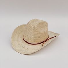 The Meadow straw cowboy hat is lightweight, durable. It's the prefect summer hat for a day at the beach or while cruising around town. These hats are individually handcrafted with sustainable palm leaf and naturally tanned leather by artisans in Guerrero, Mexico, in a fair trade environment. Each hat is unique and may vary in size and color and have small imperfections. -Crown height: 5.0", Brim length: 4.0" curved up brim -Removable naturally tanned brown leather band***leather band may vary fr Natural Hat Band With Flat Brim For Country Events, Natural Hat Bands For Kentucky Derby, Kentucky Derby Toquilla Straw Sun Hat, Adjustable Natural Panama Hat For Ranch, Flat Brim Natural Hat For Ranch, Artisan Fedora For Summer Rodeo, Artisan Style Fedora For Summer Rodeo, Artisan Summer Fedora For Rodeo, Casual Natural Straw Hat For Western Style