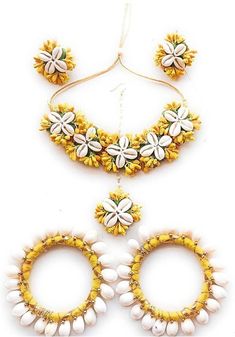 This floral🌹 Jewellery set can complete the ethnic look of a Women on Occasion like Wedding, birthday, Haldi and Baby Shower as this piece adds that extra something that makes you feel special and looking your best. Generic name - Jewel set Collection - Ethnic Material - Artificial Flowers And Cowrie Shells Sales Package - 1 Jewellery Set, 1 Packing Box ( 1 Necklace, 2 Bangles , 2 Earrings , 1 Maangtika) Occasion - Feel Beautiful with this handmade piece of Jewelry. When You are Celebrating your Special Occasion: Wedding / Party / Baby Shower / Bridal / Haldi / Mehandi / Festive Season. Ideal for Gift / Pre Shoot / Return Gift for Wedding functions Thank you for taking time for us ! White Ceremonial Jewelry For Festivals, Ceremonial White Jewelry For Festivals, Traditional White Jewelry For Festivals, Festive Jewelry Sets With Gota Work As Gift, Traditional White Jewelry With Cutdana, White Temple Jewelry With Motifs, Traditional Bridal Sets For Diwali, Flower Shaped Wedding Jewelry, White Temple Jewelry For Navratri