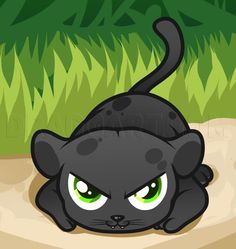 a black cat with green eyes laying on the ground in front of some grass and bushes