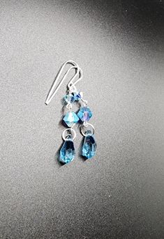 Beautiful Austrian aquamarine teardrop earring. Blue Teardrop Crystal Earrings With Ear Wire, Blue Crystal Teardrop Dangle Earrings, Crystal Teardrop Single Earring, Blue Crystal Teardrop Earrings, Blue Teardrop Dangle Earrings, Blue Teardrop Crystal Earrings, Teardrop Crystal Single Earring, Blue Teardrop Crystal Earrings For Pierced Ears, Turquoise Teardrop Crystal Earrings