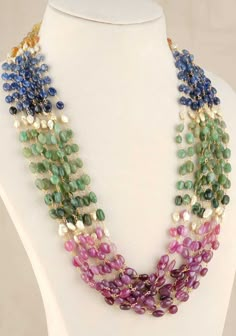 This multistrand necklace has real and natural Rubies, Emeralds, Blue Saphire and Yellow Saphire strung into multiple strands using real 92.5 silver plated with 24 Kt Gold wires.  The necklace is prominent and with it's rich composition of colors, sure to add bold charm to any ensemble. The stones being all natural will have slight variances in color, texture and shapes. These are natural and attest to the authenticity of these stones.  Height-280 mm, Width-170 mm Note Product Care: To maintain Luxury Multicolor Beaded Necklaces For Celebration, Luxury Classic Multi-stone Necklaces, Luxury Handmade Multicolor Temple Necklace, Luxury Multicolor Tilla Temple Necklace, Beads Necklace Outfit, Emerald Mala, Ruby Jewelry Necklaces, Stone Jewellery Designs, Choker Necklace Designs