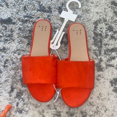 Size 7. From Target. A New Day. New. Orange Round Toe Slippers For Spring, Orange Flat Slippers For Spring, Orange Open Toe Sandals With Textured Footbed, Orange Open Toe Slippers For Summer, Orange Flat Sandals For Spring, Orange Open Toe Slippers For Spring, Orange Open Toe Spring Slippers, Orange Flat Slippers For Summer, Chic Flat Orange Sandals