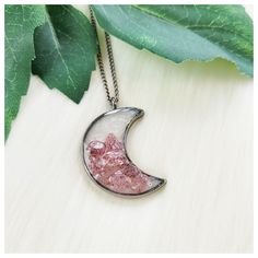 "Handmade strawberry quartz and rose quartz crescent moon bezel resin pendant necklace. Pendant Size: See Pics For Measurements & Size Scale Comparisons Chain Length: My pendant necklaces are made with a standard \"Princess\" length 18\" chain; I also offer custom length options. Choose your custom length by using the \"Necklace length\" drop-down menu located just above the add to cart button* (*length reference chart shown in pics) Colors: Pastel Pink, Dark Magenta Pink, Pearl White, Gunmetal Silver Gray Materials: Pendant: Strawberry Quartz Chips, Rose Quartz Chips, Resin, & Silvertone Stainless Steel Chain: Gunmetal Silvertone Stainless Steel (due to a variety of monitor/screen settings, IRL color may vary slightly, pics taken in natural light)" Half Moon Metal Necklace For Gifts, Half Moon Metal Necklace For Gift, Half Moon Metal Jewelry Gift, Pink Bohemian Resin Jewelry, Bohemian Pink Resin Jewelry, Pink Moon Charm Jewelry, Pink Round Moon Charm Jewelry, Handmade Crescent Resin Jewelry, Pink Moon-shaped Jewelry With Moon Charm