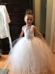 This listing is for a flower girl tulle tutu skirt. The body suit and jacket are not included but I can recommend a site where they can be purchased. The skirt is made of tulle and an elastic band. There are multiple colors that the skirt can be made in. I prefer to make the items to order so message me if you would like something similar to what is shown. (Different color/add ribbon/etc.)  Prices are based on sizes and material that is being used. Princess Style Tulle Tutu Dress For First Communion, Spring Pageant Tutu Dress With Tulle Skirt, Fitted Tulle Tutu Dress For Pageant, Fitted Princess Tutu Dress For First Communion, Princess Style Fitted Tutu Dress For First Communion, Tulle Tutu Dress For Pageants, Tulle Tutu Dress For Pageant, Spring First Communion Tulle Tutu Dress, Ballet Style Tulle Petticoat