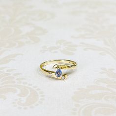 14K Yellow Gold Estate Pear Shaped Tanzanite Ring with Diamond Accents. Size 6 1/2. Weighs 1.6 grams. Gold Tanzanite Diamond Ring Fine Jewelry, Gold Tanzanite Birthstone Ring For Wedding, Gold Tanzanite Wedding Ring, Gold Tanzanite Birthstone Ring, Gold Tanzanite Birthstone Wedding Ring, Gold Tanzanite Wedding Birthstone Ring, Gold Birthstone Ring With Tanzanite, Gold Tanzanite Rings With Accent Stones, Gold Tanzanite Birthstone Ring As Gift