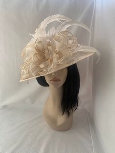 This is an ivory Elegant wide turn-down Brim sinamay hat perfectly styled  with cream long feathers and beige sinamay bows for Kentucky derby, Belmont, Steeplechase, Melbourne cup, or any other hat wearing races event. Great for COGIC Women's  convention church hat and is  lovely for spring/summer wedding for Mother of the bride or guest hat.  Looking for a great tea Party headpiece or Mother of the bride Brunch hat, This is perfect for any special occasion.  Lightweight  Can be worn on either side Only one made! Green Fascinator, Sinamay Hats, Melbourne Cup, Tea Party Hats, Feather Fascinators, Church Hats, Fancy Hats, Fascinator Hats, Wedding Hats