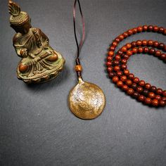 ❤This unique tibetan melong badge was handmade by Tibetan Artist from Baiyu County.It's a Astrology Protective Amulet Pendant,made of lima brass,the front pattern is Tibetan Budhist Protective Amulet Pendant - SIPAHO(srid pa ho),the back is imageof ritual conch,a bone carved dice bead in the middle of the lanyard.SIPAHO Melong Amulet on the cord,when on a go or travelling, it's placed as a waist badge.You can make it into pendant,keychain, bag hanging,or just put it on your desk,as an ornament.T Spiritual Carved Brass Jewelry, Bronze Carved Spiritual Jewelry, Adjustable Fair Trade Spiritual Jewelry, Bronze Engraved Necklace For Festivals, Bronze Engraved Necklace For Festival, Engraved Bronze Necklaces For Festivals, Brown Engraved Brass Jewelry, Bronze Amulet Jewelry For Festivals, Spiritual Bronze Necklaces For Festivals