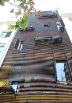 an apartment building with wooden slats on the side