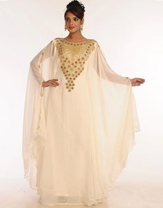 ❤️Inshallah❤️ Trendy Off White Georgette Hand Embroidery Party Wear Kaftan 👗 Order Online latest Embroidered Kaftan which are made up from best quality fabrics with latest styles from our large collections at arabicattire.com Shop Now : https://bit.ly/3Q59Xdo Buy online @ $71.5 #eveningkaftans #arabicapparel #middleeasternclothingonline #islamickaftan #fittedkaftandresses #longkaftandressesonline #dressykaftans #islamicclothingforsale #middleeastclothingforwomen Middle East Clothing, Kids Kaftan, Modest Evening Dress, Zari Embroidery, Long Kaftan, Georgette Dress, Islamic Clothing, Zari Work, Hooded Dress