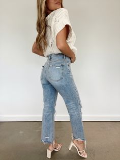 Get the perfect blend of comfort and style with our Vintage Wash Cropped Straight Denim. These high-waisted jeans have a distressed hem, button and zipper closure, as well as knee hole details. They fit straight and true to size. Pair with our Bestie Sweater for the perfect early fall look! High Rise Distressing On Knees And Hem Straight Fit 100% Cotton Hand Wash Cold High Rise Light Wash Distressed Jeans, Distressed High Rise Jeans In Medium Wash, High Rise Distressed Medium Wash Jeans, High Rise Medium Wash Distressed Jeans, Everyday Distressed Cropped Jeans For Spring, Ripped Cutoff Flare Jeans In Medium Wash, Everyday Dark Wash Jeans With Frayed Hem, Trendy Distressed Cropped Jeans For Everyday, High Rise Distressed Bottoms For Everyday