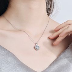 Delicate and elegant, this heart necklace will add a touch of sophistication to any wedding gown or formal ensemble. Adorned with heart-shaped cubic zirconia that captures the light from every angle with a perfectly translucent appeal, the necklace is rhodium / rose gold plated for a flawless finish which perfectly enhances the intricate detailing and conveys a modern take on old elegance. Length: 16" (approx. 40.6cm) with a 2" (approx. 5cm) extension for comfortable sizing. Available in Silver Crystal Heart Necklace With Clavicle Chain For Weddings, Crystal Heart Jewelry For Wedding, Formal Cubic Zirconia Heart Pendant Necklace, Silver Heart Necklace With Diamond Accents For Wedding, Elegant Crystal Heart Necklace For Wedding, Wedding Heart Necklace With Diamond Accents For Valentine's Day, Valentine's Day Wedding Heart Necklace With Diamond Accents, Wedding Jewelry With Diamond White Heart Pendant, Diamond White Heart Pendant Jewelry For Wedding