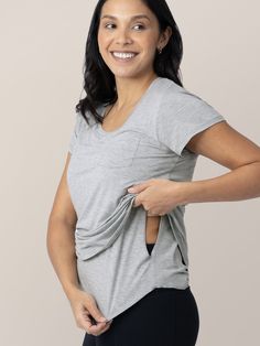 Hello, new favorite maternity & nursing T-shirt. Unbelievably soft — like your most trusted, worn-in tee — this breastfeeding-friendly shirt has a roomy-but-flattering cut and side access for nursing and pumping. Choose the Classic Style or the Pocket Style.  Hidden underlayer for easy, discreet breastfeeding Great drape and extra coverage Flattering scoop-neck nursing shirt For pregnancy through nursing and beyond Nursing Pjs, Nursing And Pumping, Nursing Sports Bra, Breastfeeding Shirt, Money Clothes, Post Partum Outfits, Nursing Shirt, Pumping Moms, Nursing Top