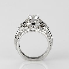 a white gold engagement ring with diamonds on it