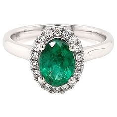 Have you seen our timeless classic style halo ring? A true symbol of refined elegance and sophistication. Meticulously crafted in 9K white gold, this exquisite piece exudes a luxurious allure. At its heart lies a Zambian oval emerald, radiating a captivating green hue that evokes a sense of natural beauty. The center stone is embraced by a halo of white natural diamonds, further enhancing its brilliance and creating a mesmerizing play of light. Rest assured, the ring is certified by the GFCO lab Luxury Green Halo Ring, Luxury Green Halo Diamond Ring, White Gold Emerald Halo Ring Fine Jewelry, Luxury Green Halo Ring Fine Jewelry, Luxury Emerald White Gold Halo Ring, Emerald Halo, Timeless Classic Style, Zambian Emerald, Zambia