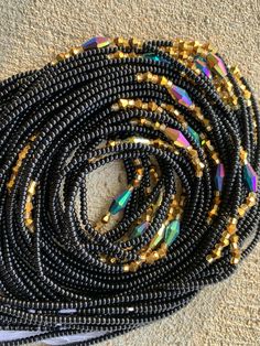 "Hi there! Thanks for your interest in these Czech waist beads. Please read below for detailed information on the listing: 🌼 This Listing is for 25, 35 and 60 strands of quality waist beads. 🌼 Length varies from 40\"- 45\" 🌼 All Beads are Tie On 🌼 You will receive almost identical beads in the pictures listed with slight variation. 🌼 All Wholesale Ship Directly from Ghana, Africa. 🌼 Retail, that is single strands ship directly from the US. 🌼 Beads are made with Strong cotton or Polyester Party Beaded Chain Necklace With Metal Beads, Party Beaded Necklace With Metal Beads, Party Metal Beaded Chain Necklaces, Festival Waist Beads With Round Beaded Chain, Festival Waist Beads With Beaded Chain, Festival Beaded Necklace With Round Black Beads, Bohemian Beaded Chain Waist Beads, Oval Beads Beaded Necklaces For Party, Bohemian Beaded Waist Beads For Parties