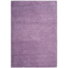 a purple rug on a white background with no one in the room to see it