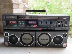 an old radio sitting on top of a table