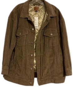 a brown jacket is hanging on a hanger