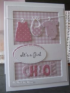 a handmade card with clothes hanging on a line and the words let's a girl