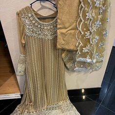 Not Sana Safinaz Agha Noor Asim Jofa Thread And Motifs Maria B, Khadi, Faiza Saqlain Unstitched Gold Dress In Shantoon, Unstitched Gold Shantoon Dress, Gold Shantoon Dress With Dabka Work, Gold Shantoon Bollywood Dress, Gold Dress With Dabka Work On Shantoon, Gold Dress With Dabka Work, Gold Anarkali Dress In Shantoon, Traditional Salwar Kameez With Gold Embroidery For Wedding, Traditional Wedding Salwar Kameez With Gold Embroidery