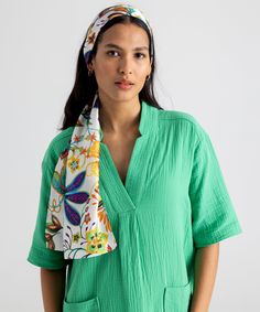 This versatile, 100% silk scarf adds a colorful floral pop to a spring or summer ensemble. Wear it as a flowing head wrap, tie it around the neck or even wear it as an eye-catching belt. Dimensions: 13 in. x 72 in.Materials: 100% Silk Made in: China Bohemian Silk Scarf For Summer, Bohemian Bandana For Beach In Summer, Bohemian Silk Scarf For Beach In Spring, Summer Beach Silk Scarf, Elegant Summer Beach Scarves, Chic Summer Beach Headscarf, Summer Vacation Bandana, Elegant Green Scarves For Summer, Elegant Green Summer Scarves