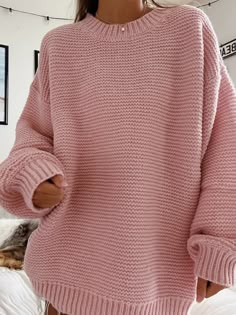 Chunky ribbed knit pullover sweater with a round neck and long sleeves. The cuffs and the neck line are both ribbed.  The Model is 5'6 and is wearing a size medium Pink Fall Sweater With Ribbed Cuffs, Fall Pink Sweater With Ribbed Cuffs, Oversized Ribbed Crew Neck Cropped Sweater, Oversized Ribbed Cropped Sweater With Crew Neck, Cozy Chunky Knit Solid Sweater, Cozy Solid Color Chunky Knit Sweater, Ribbed Acrylic Sweater, Cozy Pink Sweater With Ribbed Cuffs, Cozy Cropped Turtleneck Sweater With Ribbed Cuffs