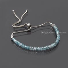 "PRODUCT DETAILS :  ITEM : BLUE ZIRCON BOLO CHAIN SILVER BRACELET ITEM CODE : DGC4852 STONE NAME : BLUE ZIRCON MATERIAL : 925 STERLING SILVER, GEMSTONE CHAIN STYLE : BOX CHAIN BEADS SHAPE : FACETED RONDELLE BEADS SIZE : 3-3.5 MM Approx. LENGTH : 10\" INCH ADJUSTABLE BRACELET ( 4 INCH FRONT STONES) WEIGHT : 25 Cts. Approx. CUSTOMIZATION : **AVAILABLE** PLEASE FEEL FREE TO CONTACT US IF YOU HAVE ANY QUERIES." Adjustable Sapphire Crystal Bracelet, Blue Adjustable Chain Bracelet, Hand-strung Adjustable Sapphire Jewelry, Adjustable Faceted Sapphire Bracelets, Adjustable Faceted Sapphire Bracelet, Adjustable Hand-strung Sapphire Jewelry, Adjustable Sapphire Beaded Bracelets With Gemstones, Adjustable Blue Round Bead Chain Bracelet, Adjustable Blue Chain Bracelet With Round Beads