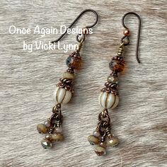 “Cashmere Glow” - Dangle Earrings Hand Created - Once Again Designs By Vicki Lynn These Limited Edition Earrings Feature An Array Of Stunning Czech Glass Beads In Creams And Browns. Small Dangles Have A Warm Iridescent Glow. Copper Findings Enhance The Look. Can Be Worn For Casual Events Or For A Night Out. This Pair: - Czech Glass Rondelles, Rounds, And Faceted Beads. - Tierracast Copper Bead Caps And Finding. - Tierracast Quality Niobium Hypoallergenic French Hook Ear Wires With Delicate Coppe Large Beaded Earrings, Wire Beaded Jewelry, Czech Glass Earrings, Diy Dangle Earrings, Dyi Earrings, Vintage Accessories Jewelry, Artworks Ideas, Czech Beads Jewelry, Copper Earrings Handmade