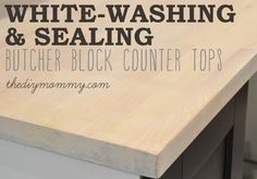 a butcher block counter top with the words white - washing and sealing on it